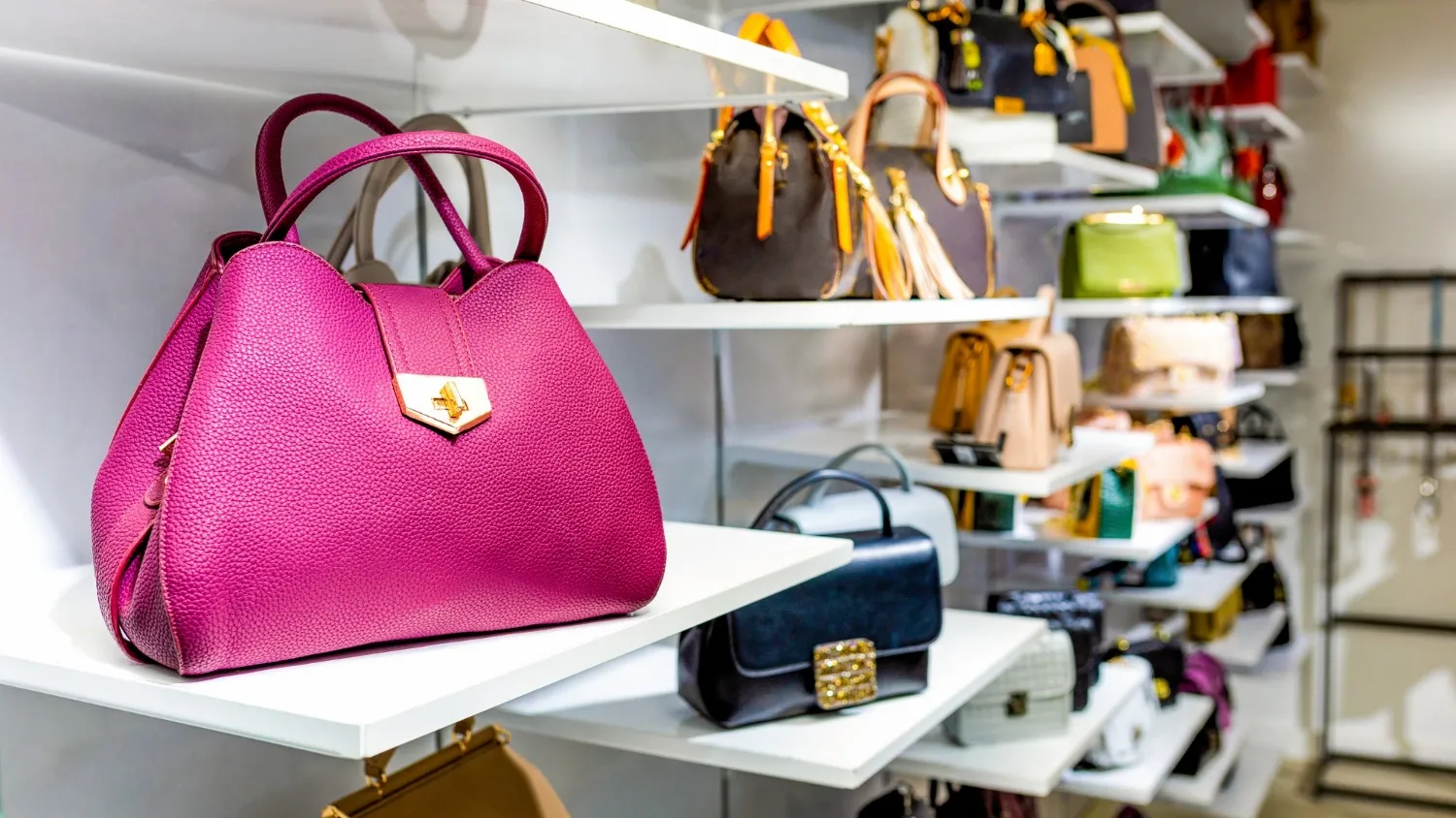 Colorful handbags in a luxury fashion store