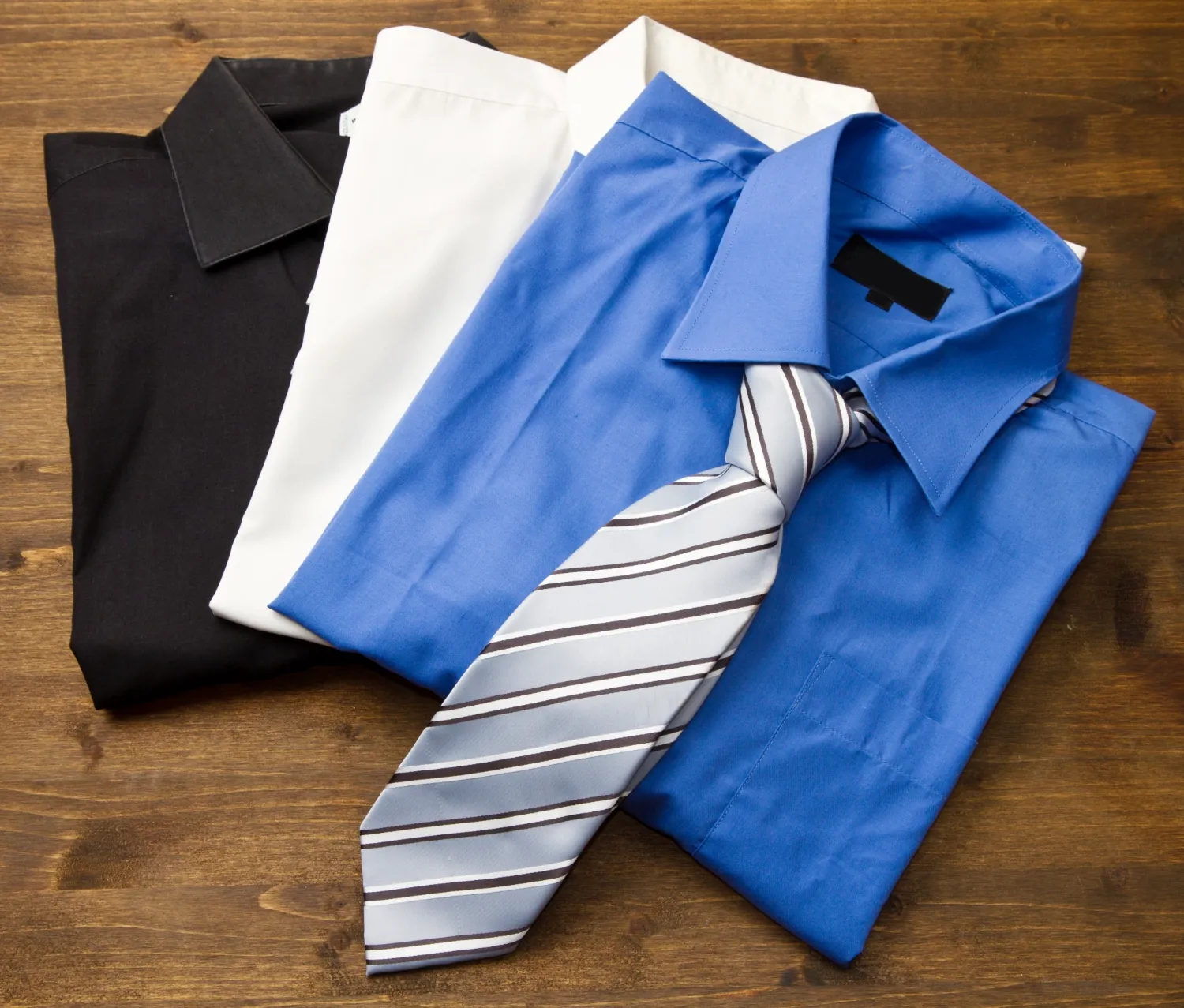 Close upfield with stacked shirts with tie