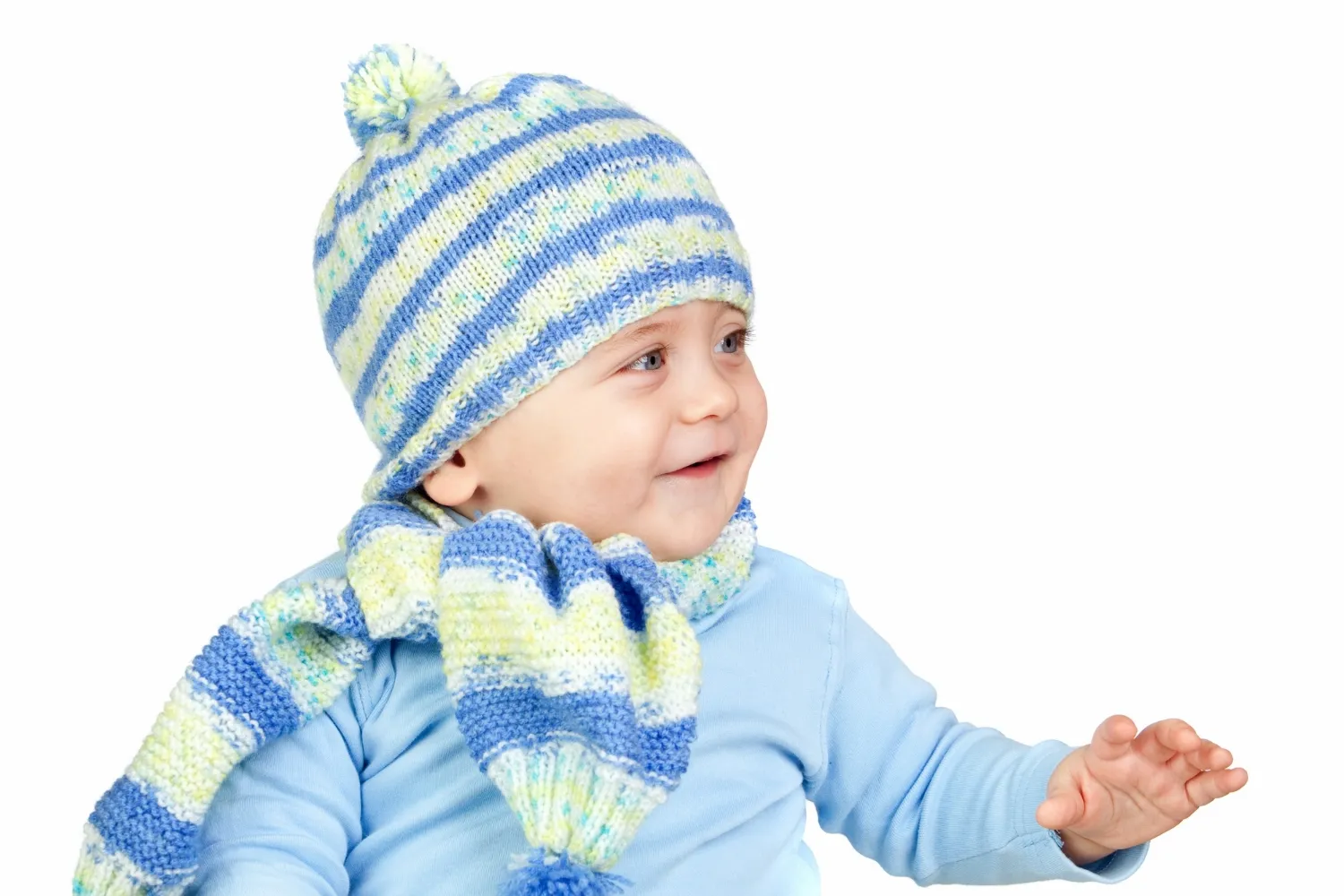 Beautiful baby warm with hat and scarf isolated