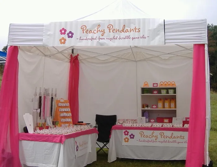 a booth at a craft show for how to display table runners at craft show