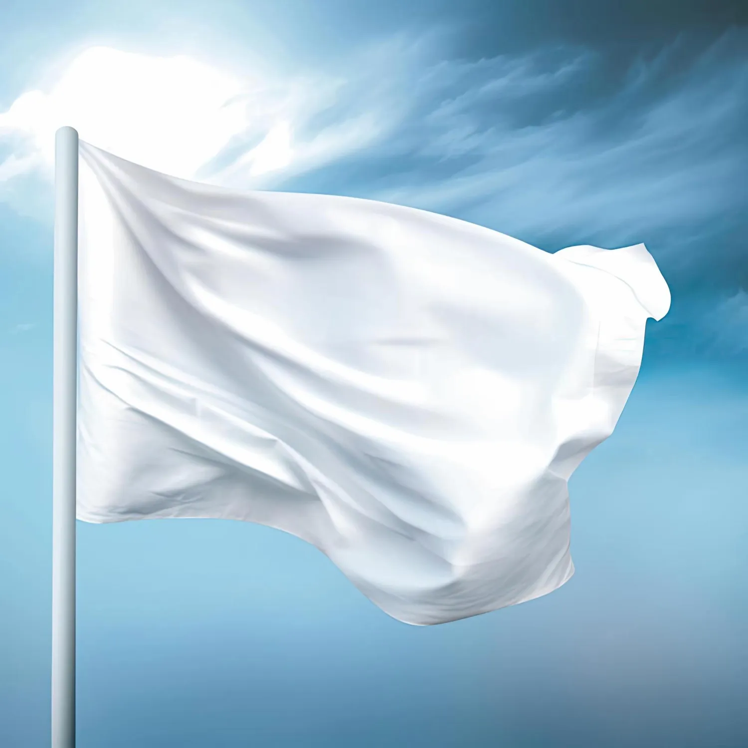 Blank white flag waving in the wind on a blue sky background