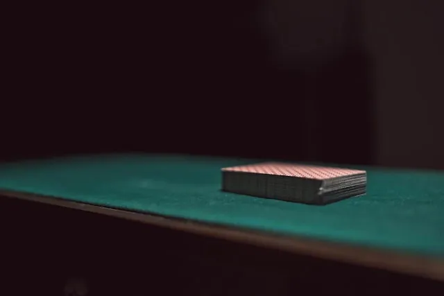 a stack of playing cards on a table for card table tablecloth size