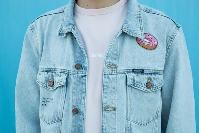 a denim jacket with an iron-on patch for how to remove iron-on patches