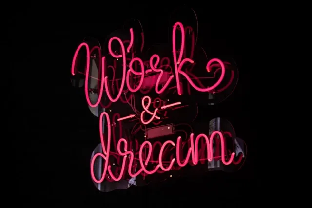 a neon sign that says work and dream for do neon signs get hot
