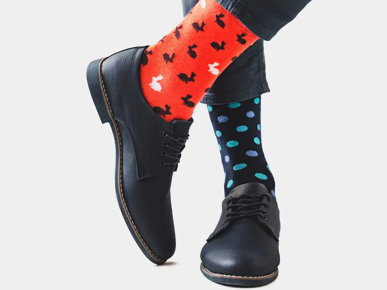 Mens legs, trendy shoes and bright socks.