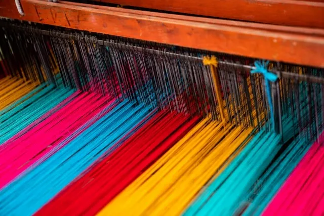 threads on a loom for woven vs embroidered patch