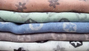 a pile of polyester fabrics for iron-on patch polyester