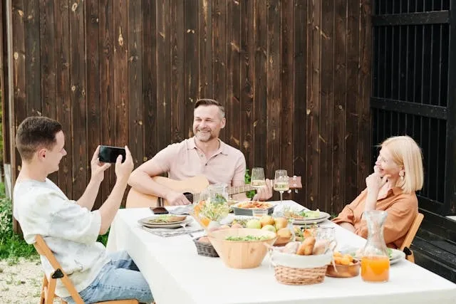 a family dining in the back yard for picnic table size tablecloth
