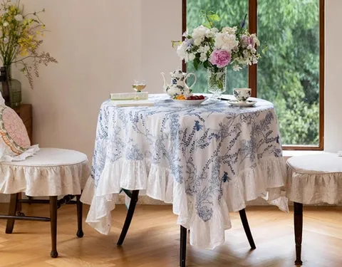 an elegant, classical table setting for rectangle tablecloth on round table