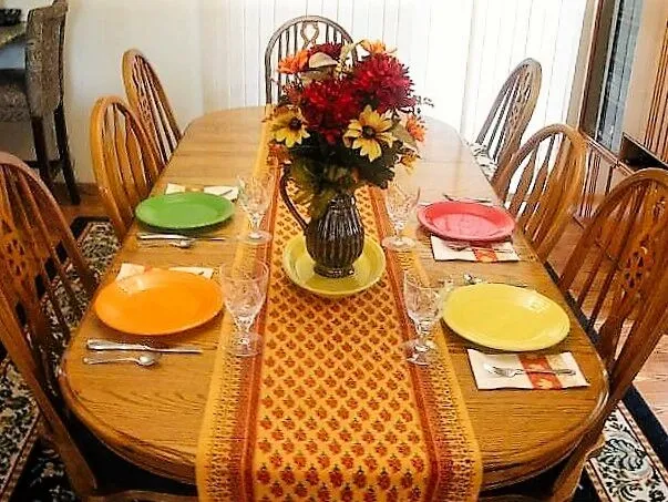 small oval table with a runner for table runner ideas