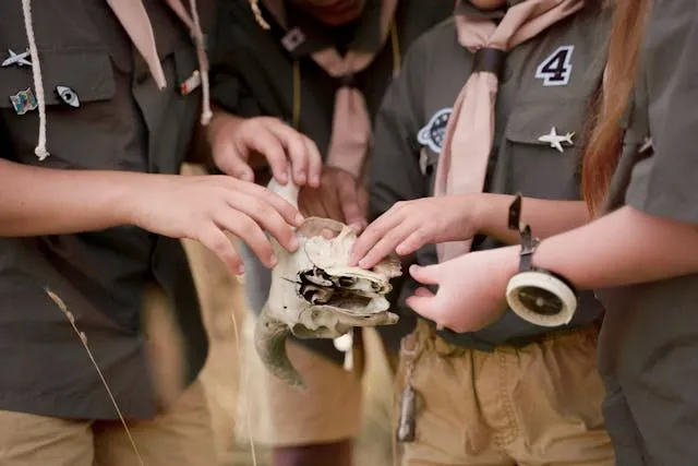 a group of young Scouts with patches on their uniforms