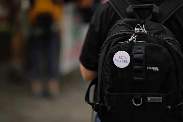 a statement patch on a backpack for how to sew a patch on a backpack