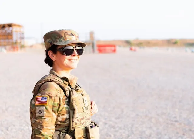 a female us army soldier in full camouflage gear for ocp patch placement