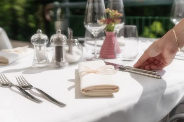 a crisp white tablecloth on an elegant table setting for type of tablecloth