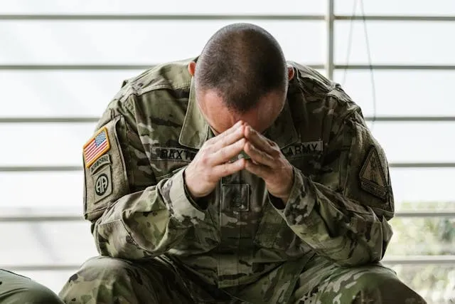 a soldier in uniform displaying patches for OCP patch placement