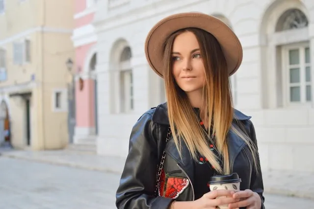 a woman wearing a leather jacket with patches for patches on a leather jacket