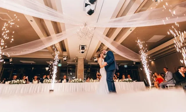 a bride and groom at a wedding reception for ivory vs white tablecloth