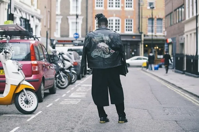 a man wearing a leather jacket with a back patch for iron on patches on leather