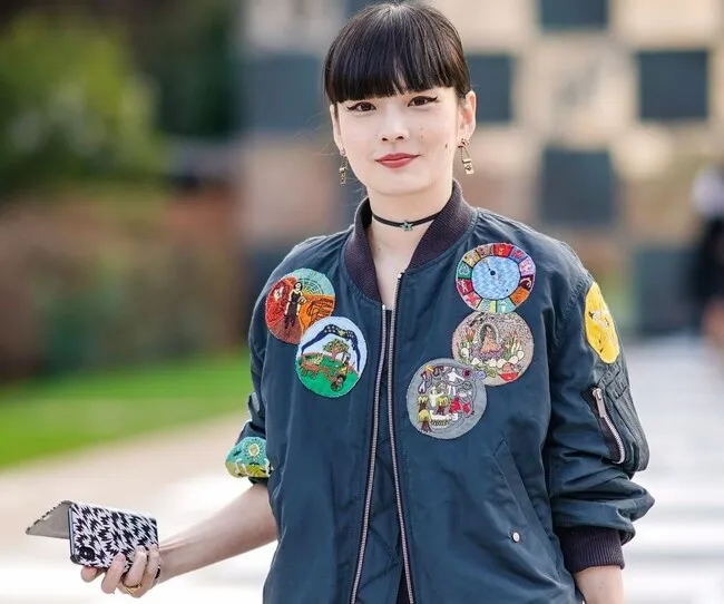 a woman wearing a patched jacket for iron on patch not sticking