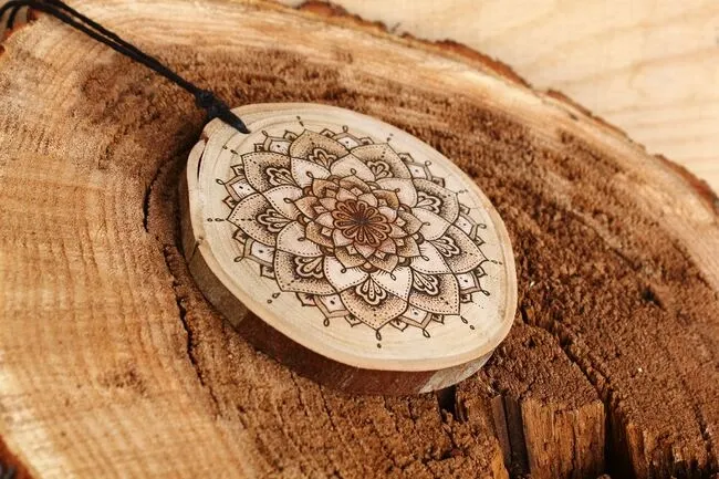 a wood burned mandala on a coaster for wood burning coaster ideas