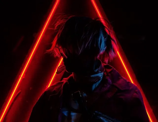 a person silhouetted by red neon lights for neon light colors