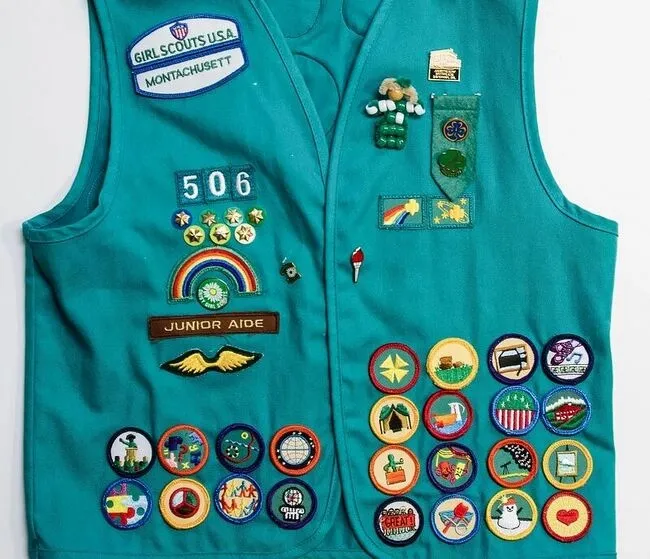 a vest with scouting patches for how to iron on girl scout patches