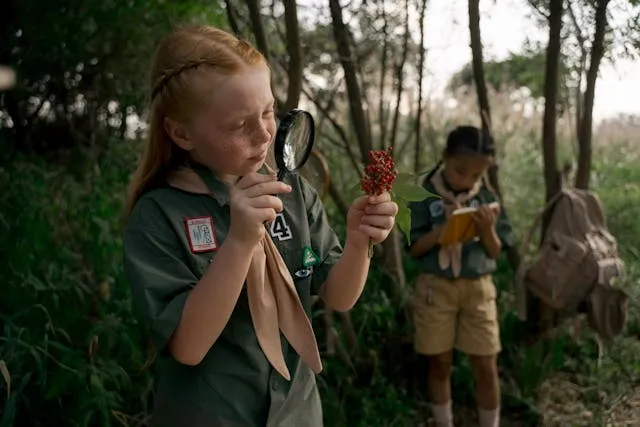 two girl scouts in the woods for how to iron on girl scout patches