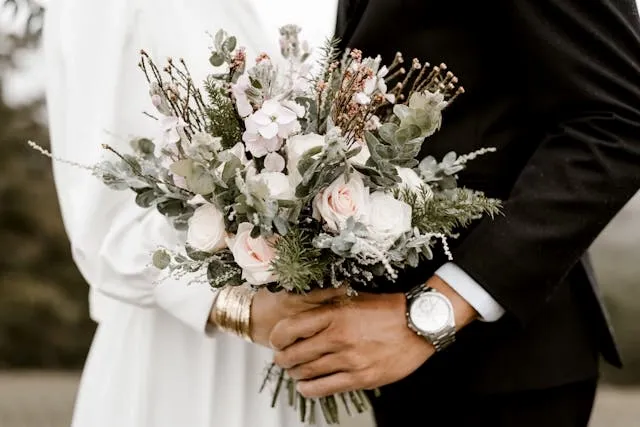 a bride and groom holding a bouquet for wedding table runner ideas