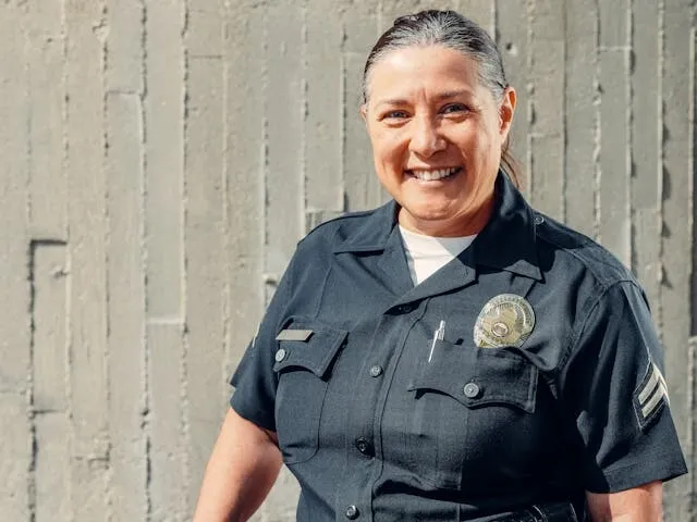 a police officer standing in front of a wall for best police patches