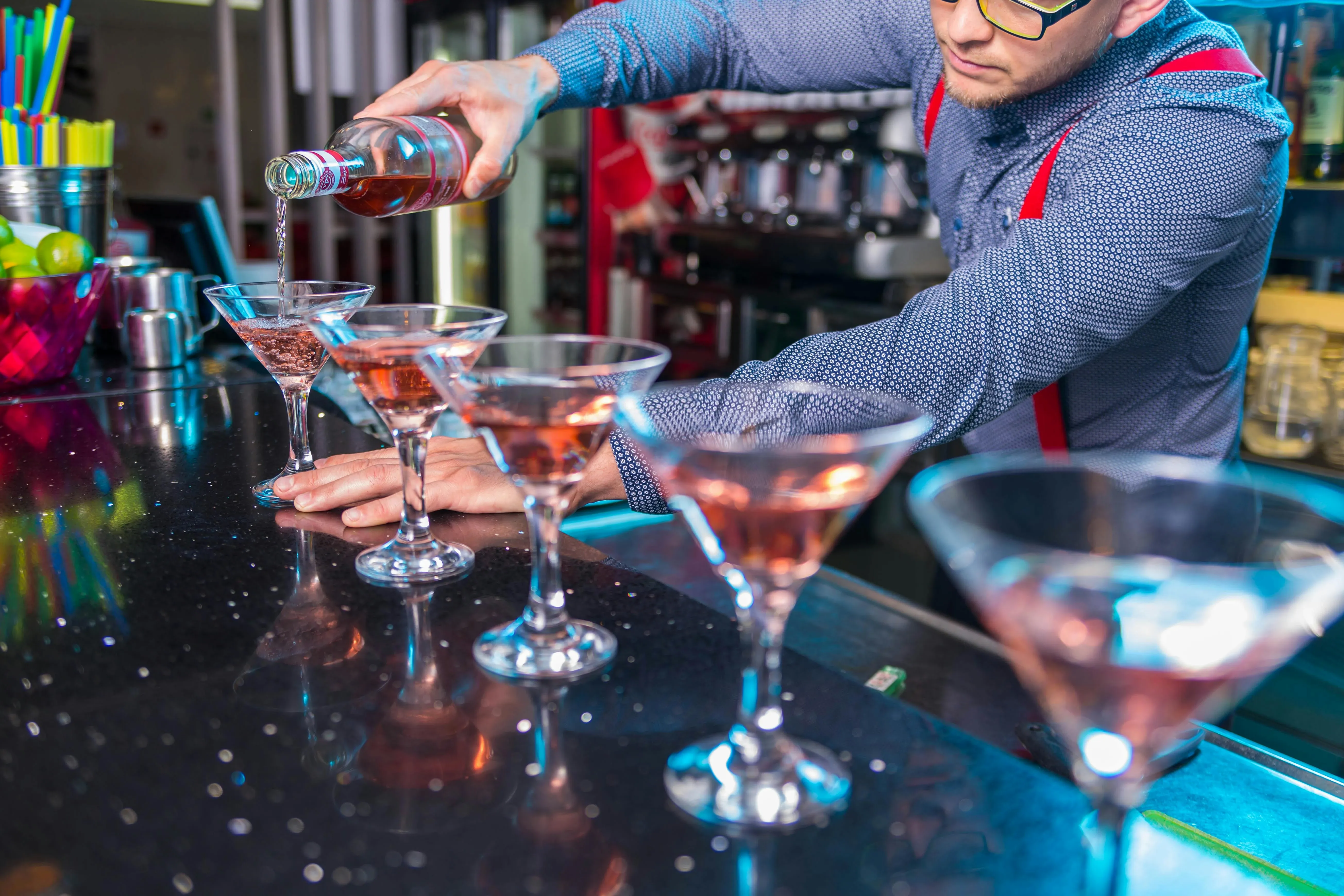 a bartender mixing some cocktails for gifts for cocktail lovers