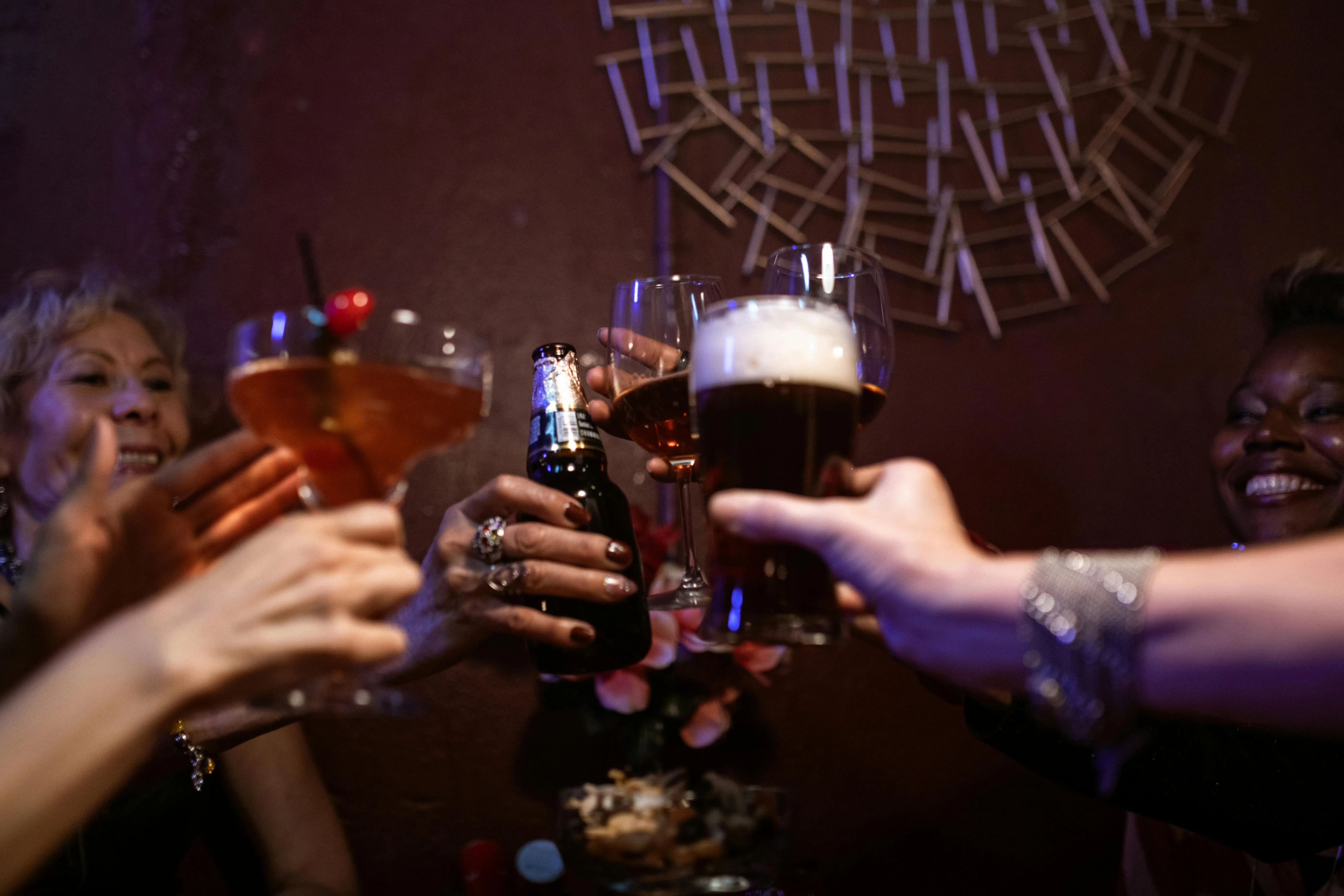 a group toasting with different beers for gifts for beer lovers