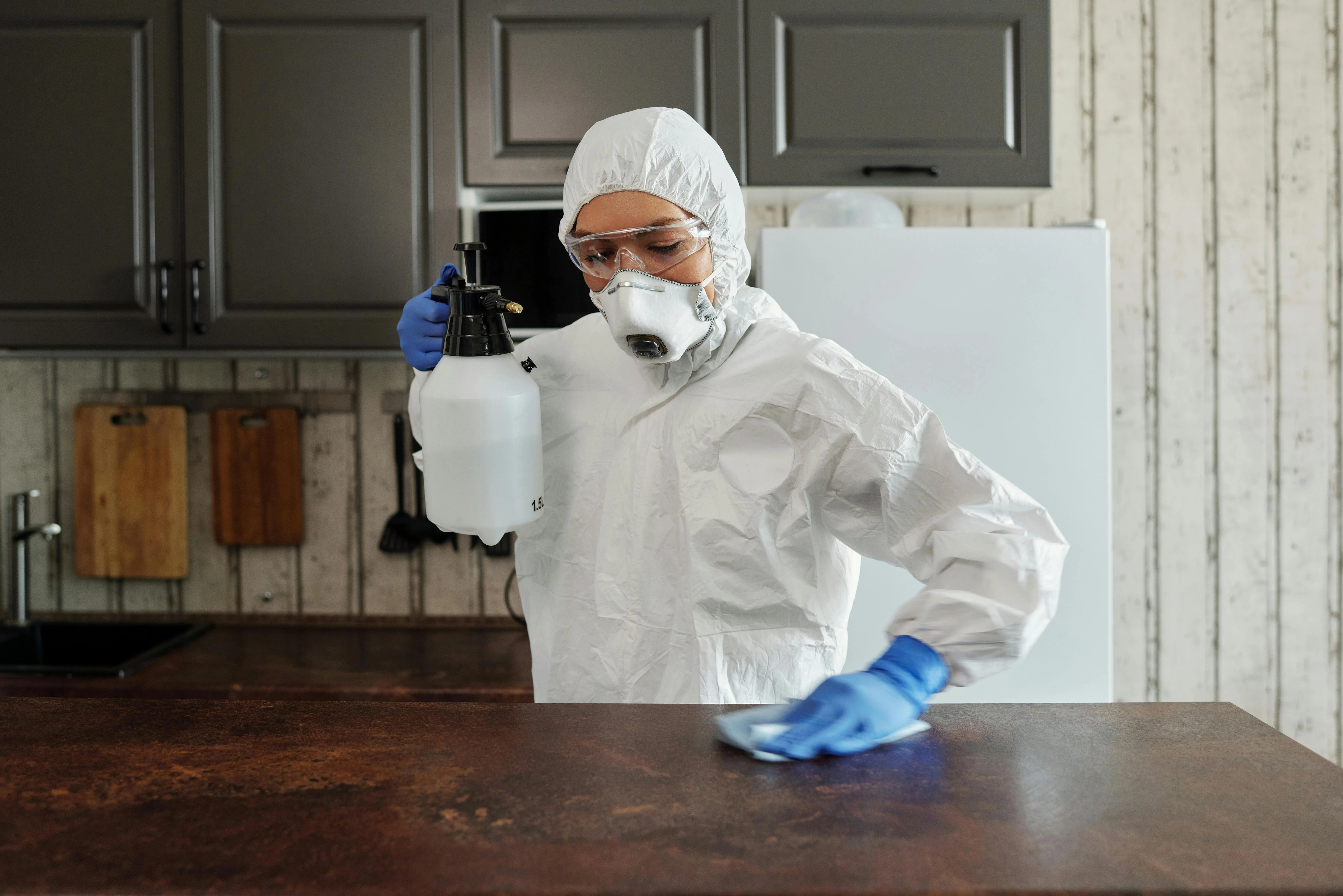 a person deep cleaning a table for how to clean tables in a restaurant