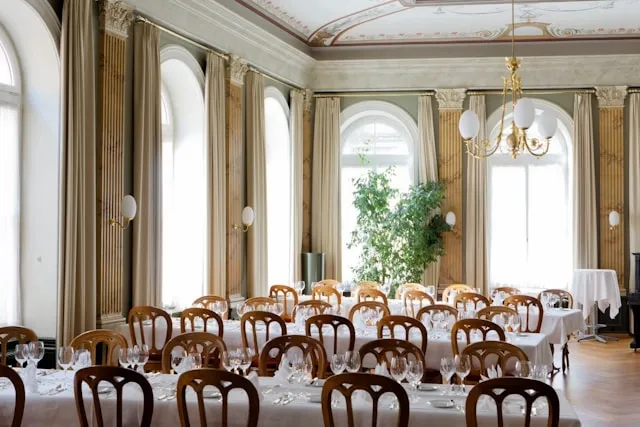 elegant dining tables arranged in rows for table set up for events