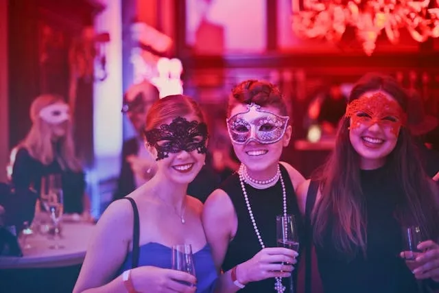 people wearing masks at an upscale party for how to organize party supplies