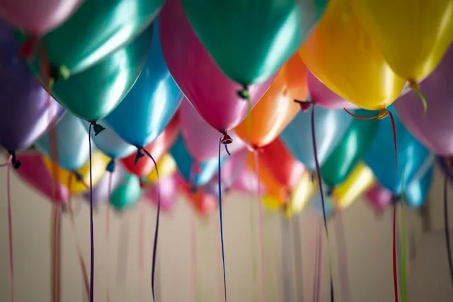 a selection of colorful balloons for party supplies list