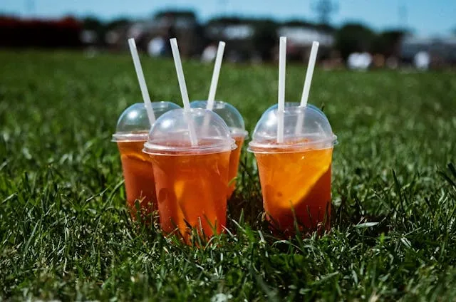 a selection of drinks on the grass for outdoor event planning