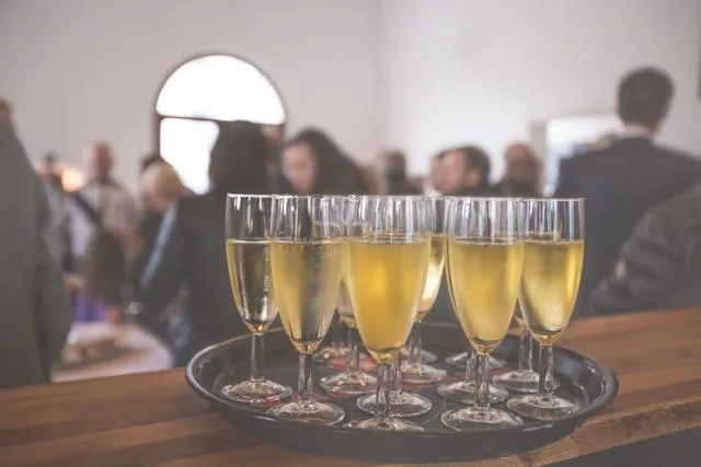 a tray full of drinks at a gathering for office party themes