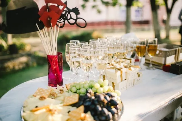 a table full of refreshments in a field for outdoor event planning