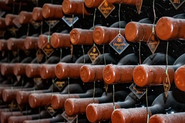 a large wine rack filled with vintage bottles for alcohol storage ideas