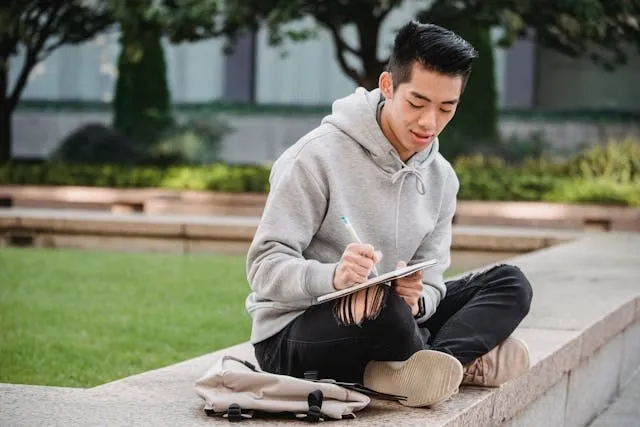 a man wearing some distressed jeans for types of jeans men