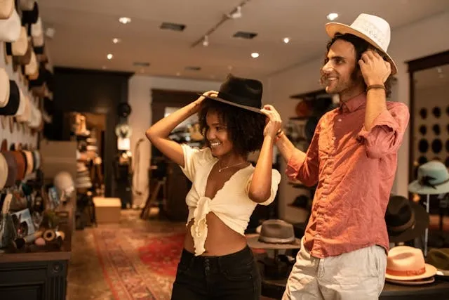 some happy customers trying on hats in an elegant store for retail store interior design