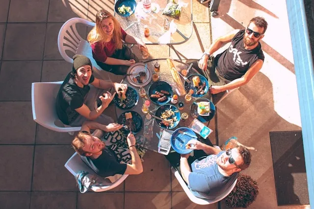 people dining around a small round table for do round tables save space