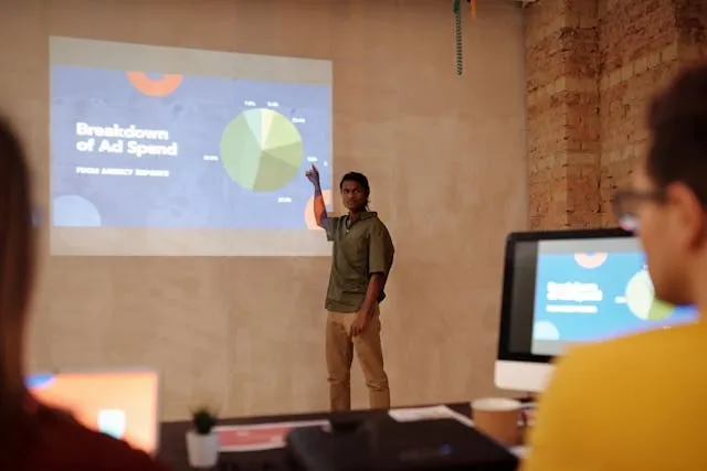 a person giving a presentation for conference room setup