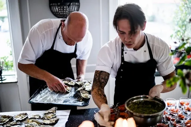 two people serving for for catering for 50 guests on a budget