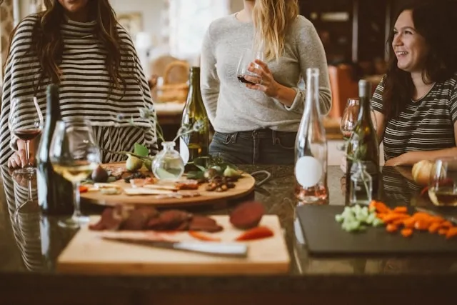 some people enjoying a dinner party for dinner party essentials