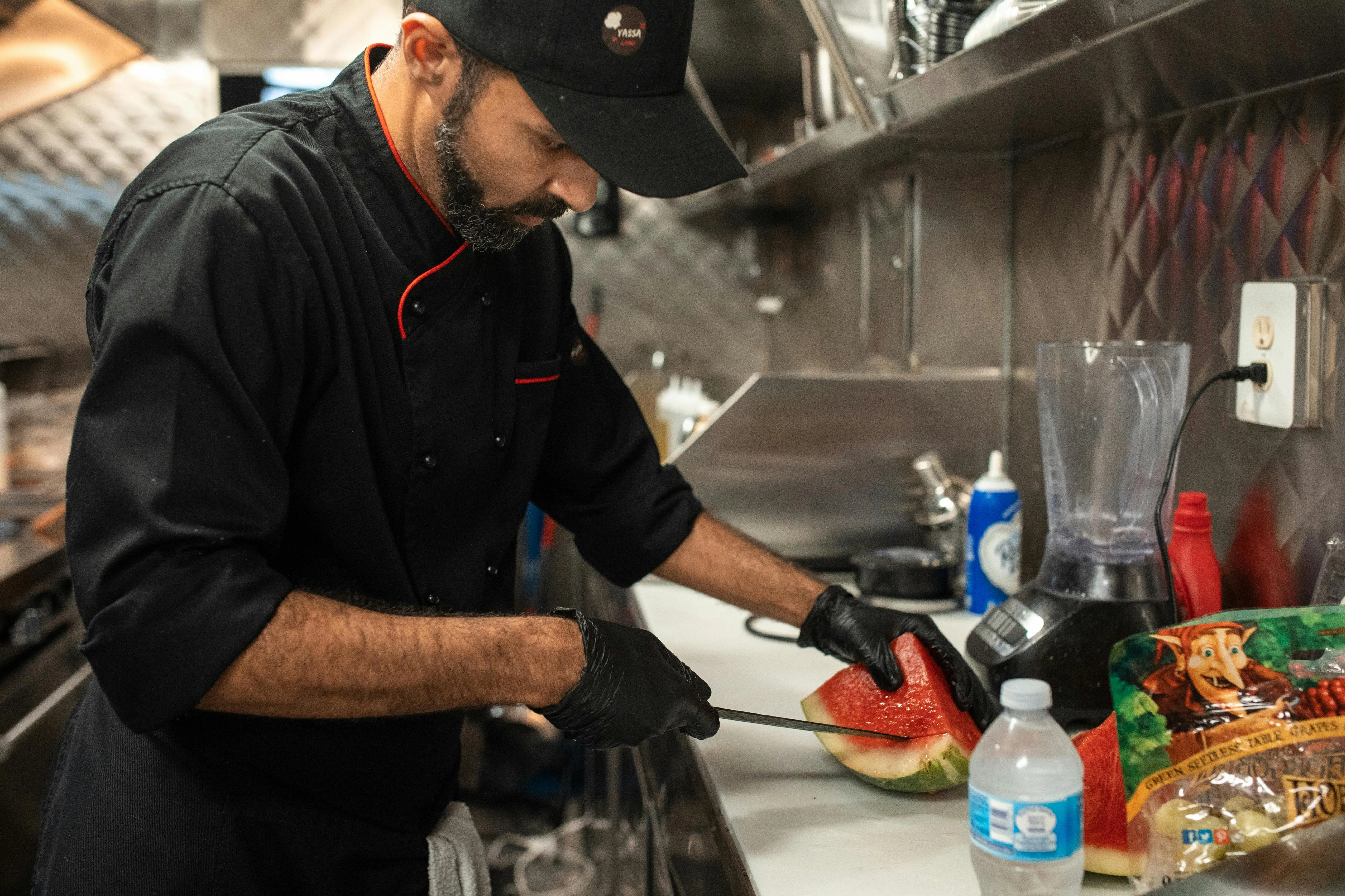 a person preparing a watermelon for what equipment do you need to start a juice bar