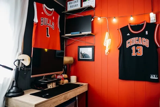 a red accent wall with a neon sign for accent wall ideas