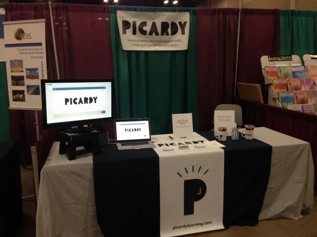 a branded trade show table with a tablecloth for trade show table display ideas