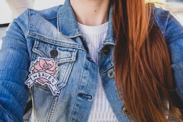 an embroidered patch on the chest of a denim jacket for patch sizes