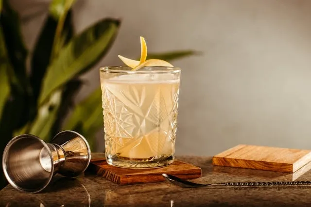 a cocktail in a glass on top of a coaster for coasters that don’t stick to glass